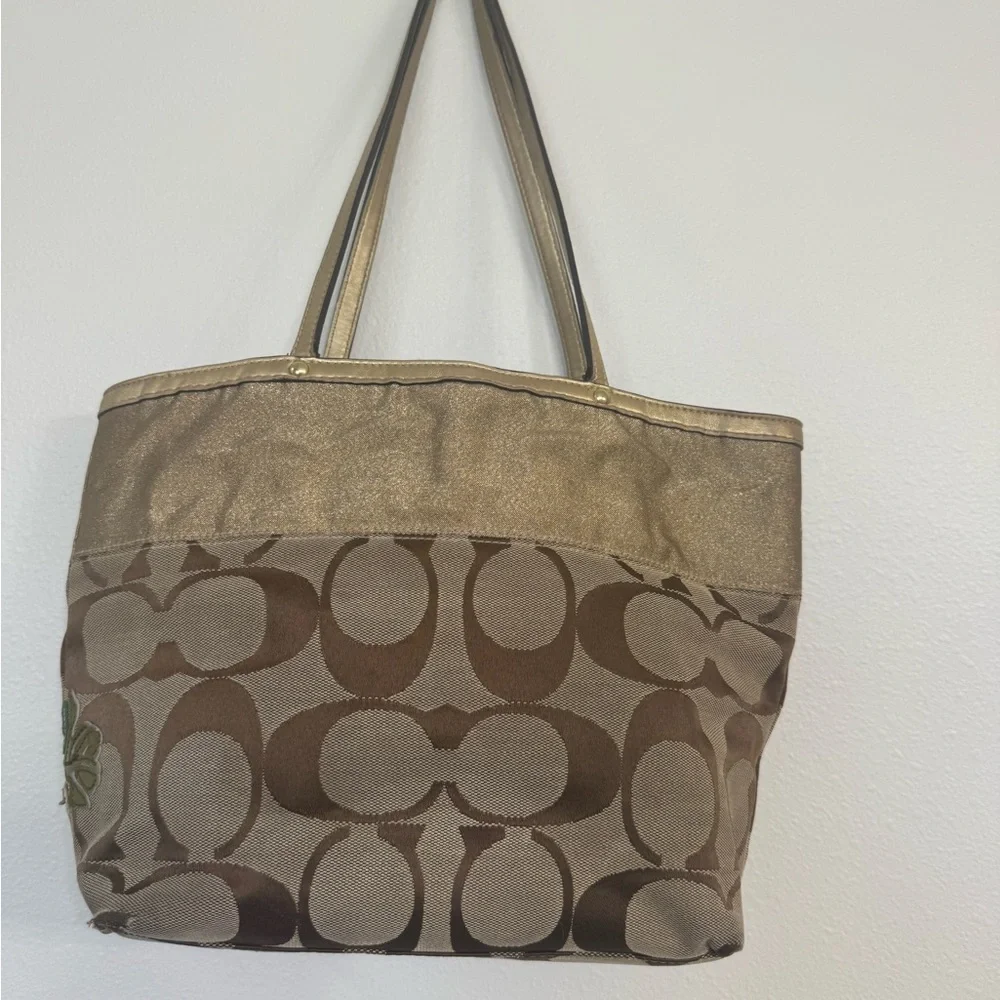 Coach chrysanthemum appliqué